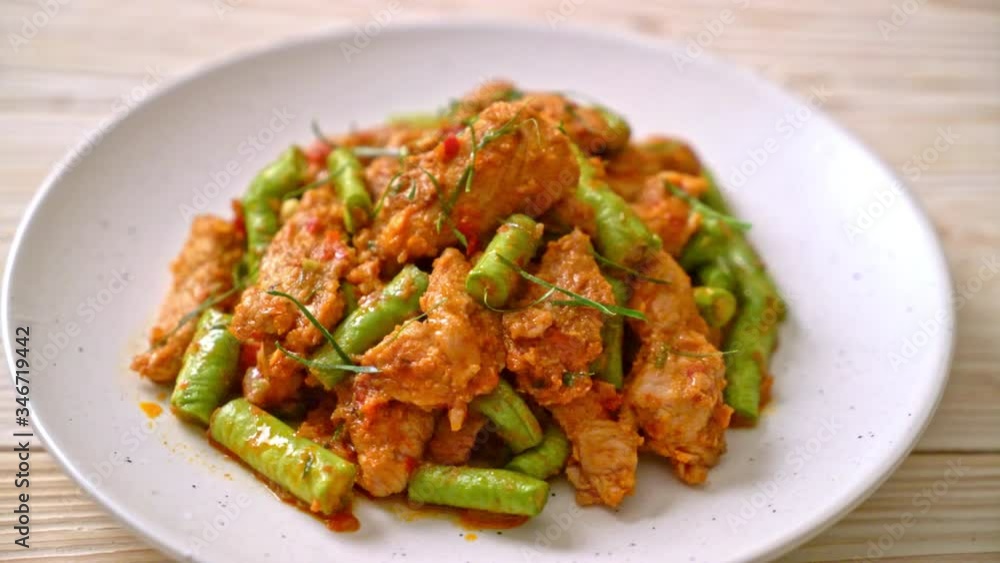 Stir fried pork and red curry paste with sting bean - Asian food style Stir fried pork and red curry paste with sting bean - Asian food style
