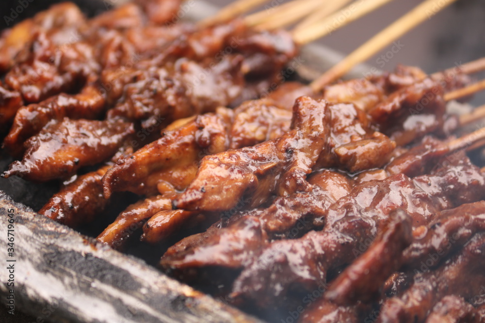 Satay (Indonesian: Sate) is a Indonesian dish of seasoned, skewered and grilled meat, served with a sauce. Satay (Indonesian: Sate) is a Indonesian dish of seasoned, skewered and grilled meat, served with a sauce.