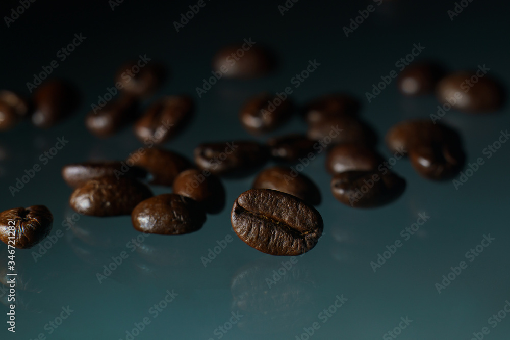 Roasted coffee beans pile on glass reflection background. Roasted coffee beans pile on glass reflection background.