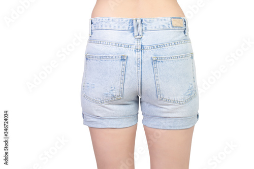 girl in a ripped denim shorts isolated on white, body part, back