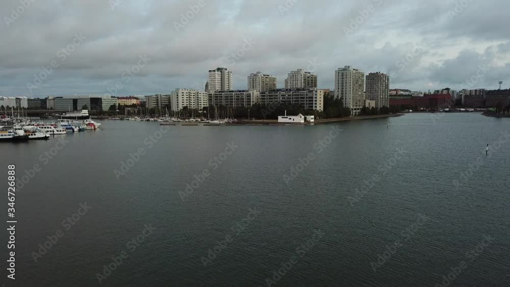 4K Helsinki Baltic Sea Finnish Bay lagoon, yachts view on cloudy summer day aerial video, Merihaka area, Tervasaari Island green park in Finland capital Suomi, northern Europe 4K Helsinki Baltic Sea Finnish Bay lagoon, yachts view on cloudy summer day aerial video, Merihaka area, Tervasaari Island green park in Finland capital Suomi, northern Europe