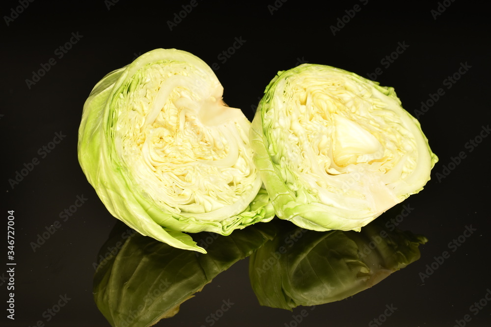 Green cabbage, macro, on a black background Green cabbage, macro, on a black background