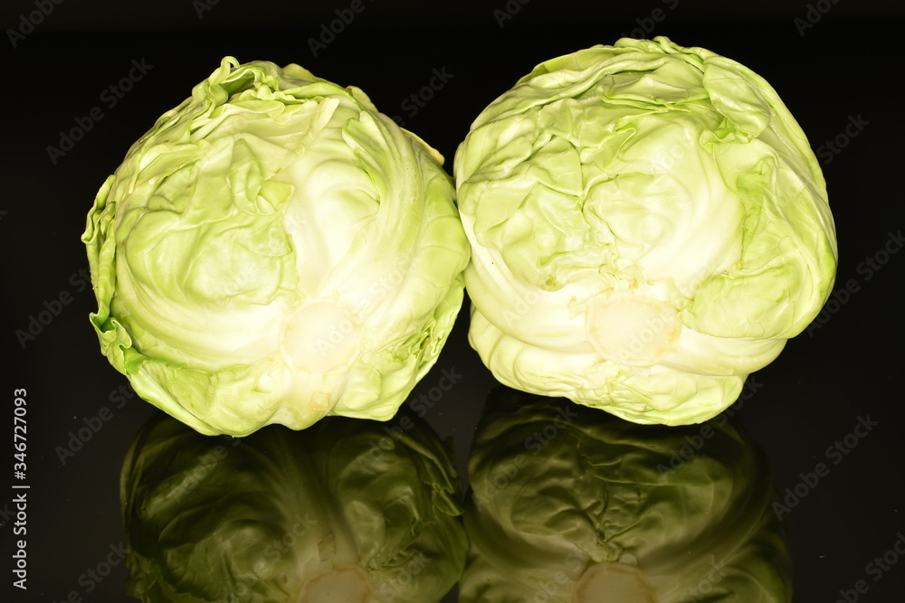Fototapeta premium Green cabbage, macro, on a black background
