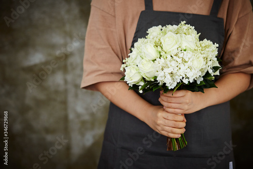 Flower bouquet in florist's hand 