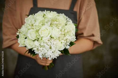 Flower bouquet in florist's hand 
