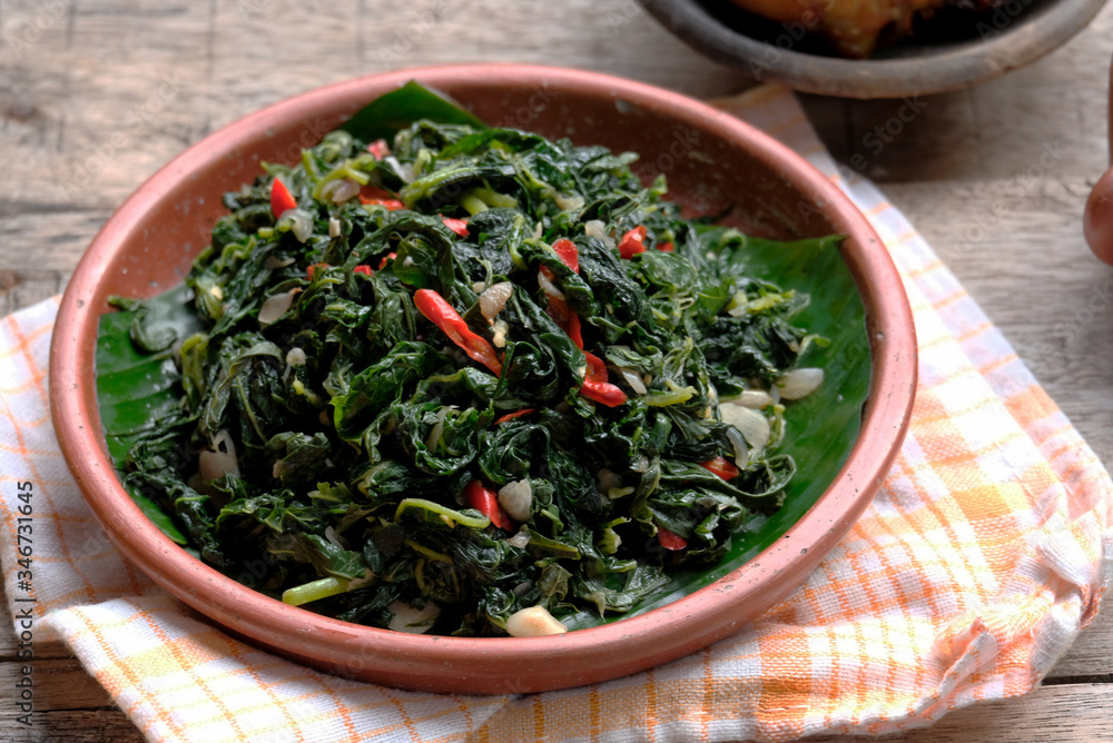 stir fry papaya leaves, also known as tumis daun pepaya stir fry papaya leaves, also known as tumis daun pepaya