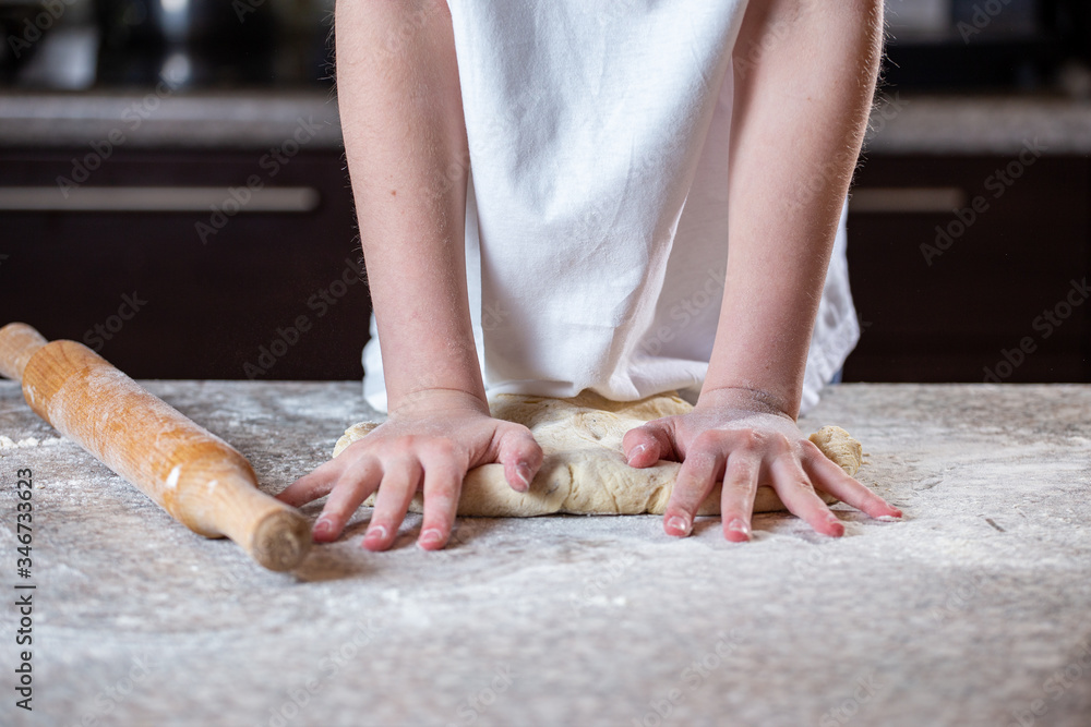 Girl making pizza dough