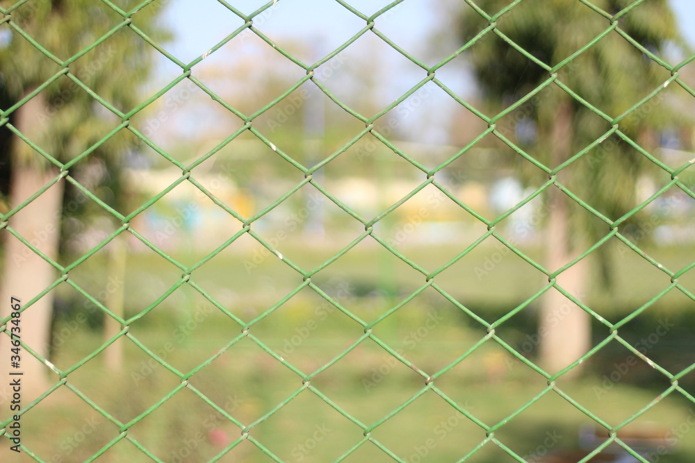 wire fence with green grass wire fence with green grass