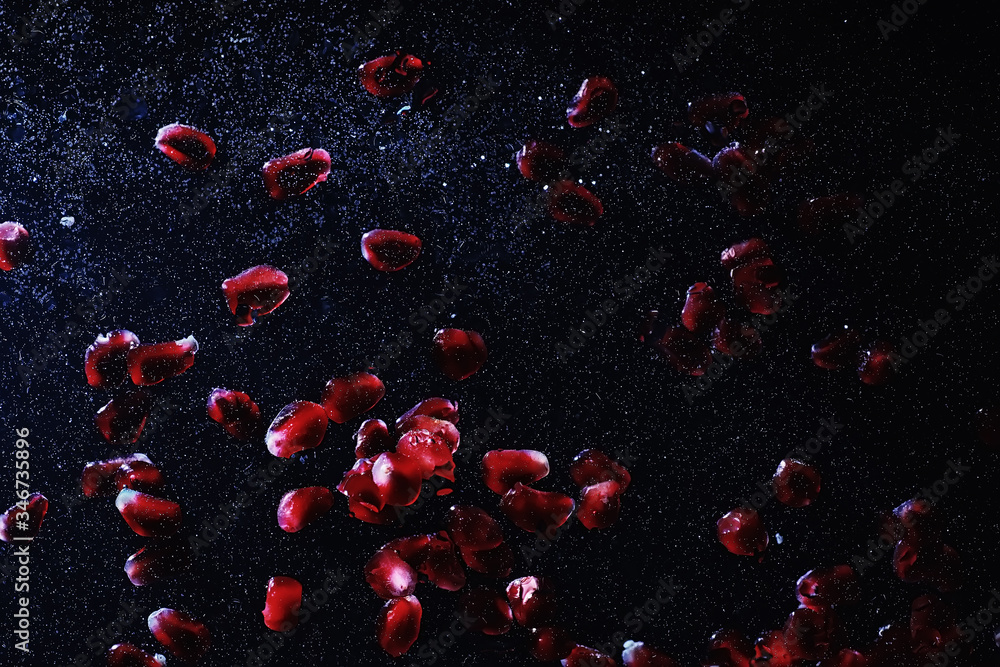 Water drops on ripe sweet pomegranate seeds. Fresh pomegranate background with copy space for your text. Vegan concept. Water drops on ripe sweet pomegranate seeds. Fresh pomegranate background with copy space for your text. Vegan concept.