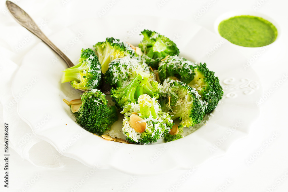 Broccoli cabbage with garlic and cheese with green sauce. Broccoli cabbage with garlic and cheese with green sauce.