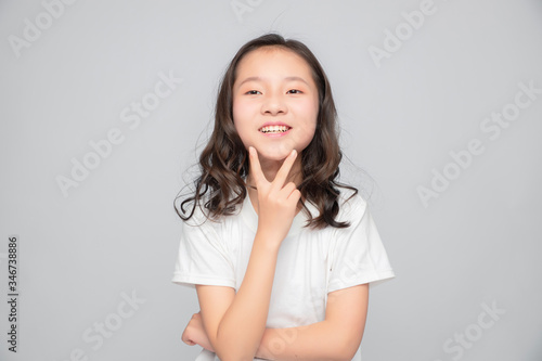 Asian primary school girls in gray background