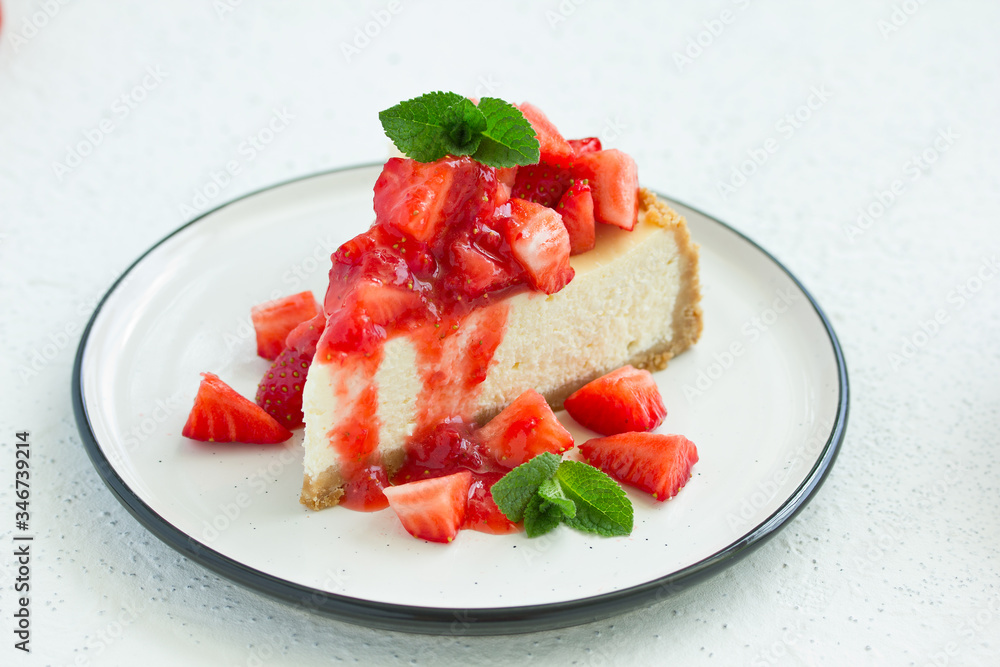 Slice of cheesecake with strawberries, mint and sauce. Selective focus Slice of cheesecake with strawberries, mint and sauce. Selective focus