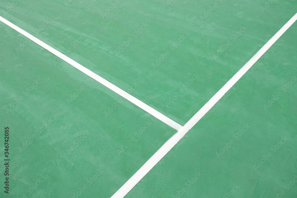 Green tennis court surface.