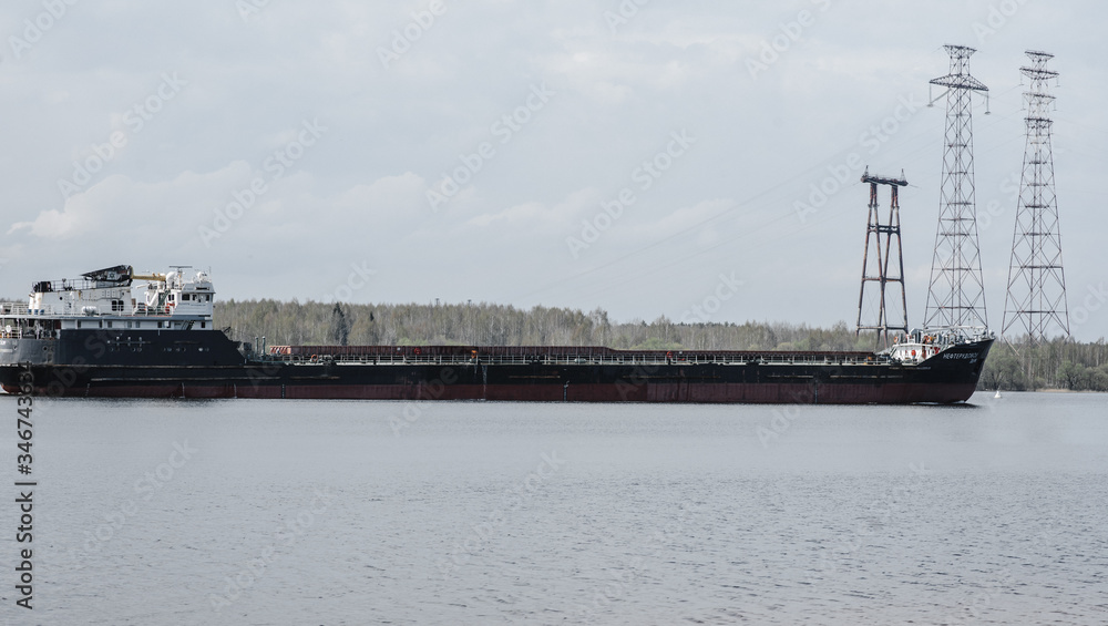 .a large empty barge floats on the river. side view .a large empty barge floats on the river. side view