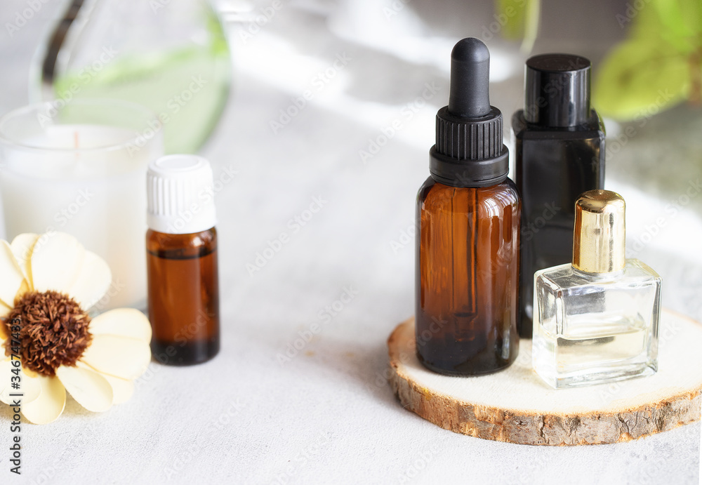 Beautiful spa composition and wellness concept with essential oil bottle, aroma candle, towel, flower and etc. Beautiful spa composition and wellness concept with essential oil bottle, aroma candle, towel, flower and etc.