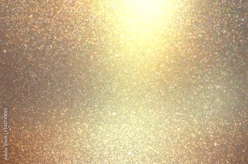 Golden glitter blur pattern. Shimmer texture. Wonderful holiday abstract background.