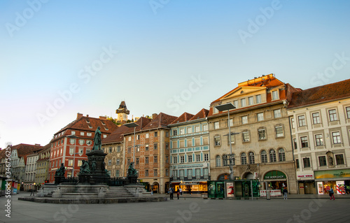 Main square in Graz, with a clock tower behind it