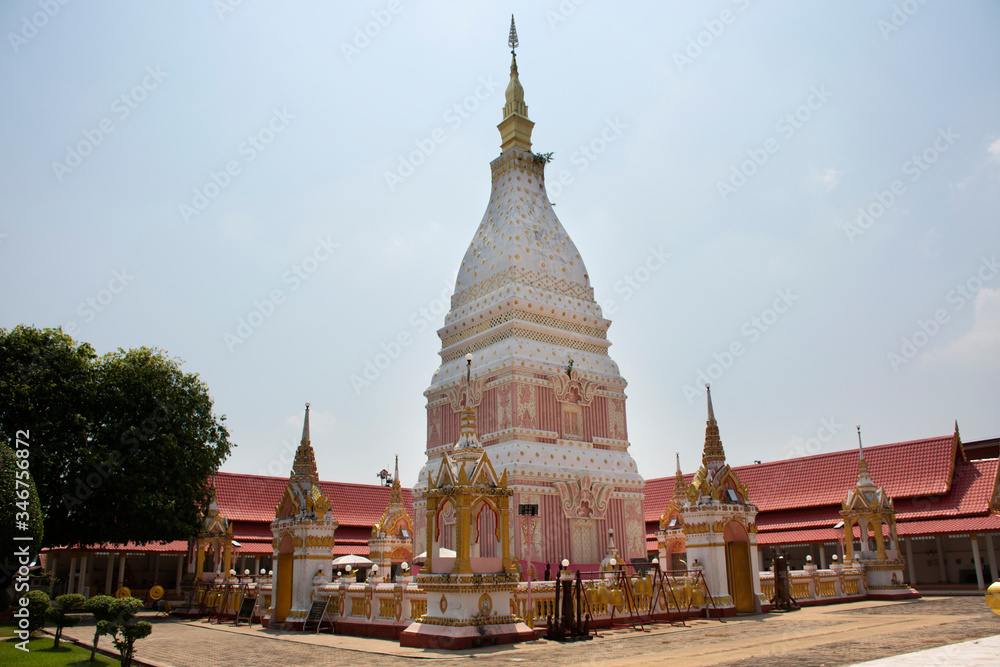 Pink and white color pagoda or stupa of Wat Phra That Renu Nakhon temple for foreign traveler and thai people travel visit and respect praying buddha and buddha's relics in Nakhon Phanom, Thailand