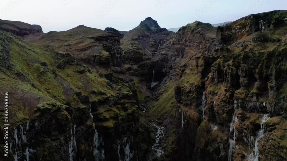 Beautiful Nature Scenery Of Hidden Canyon In South Iceland With Majestic Waterfalls - aerial drone shot Beautiful Nature Scenery Of Hidden Canyon In South Iceland With Majestic Waterfalls - aerial drone shot