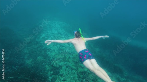 Man snorkeling under Water in a beautiful blue Ocean, Summer Holiday Adventure, Slow-Motion, Action Camera