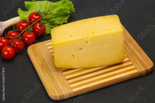 Hard yellow tasty cheese brick