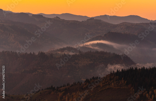 Fototapeta Naklejka Na Ścianę i Meble -  Misty Mountains Fog over forests and hills in Carpathian Mountains