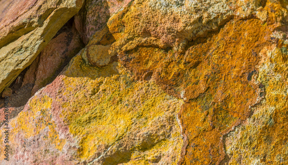 Detail of a colorful rock as a bright decorative background
