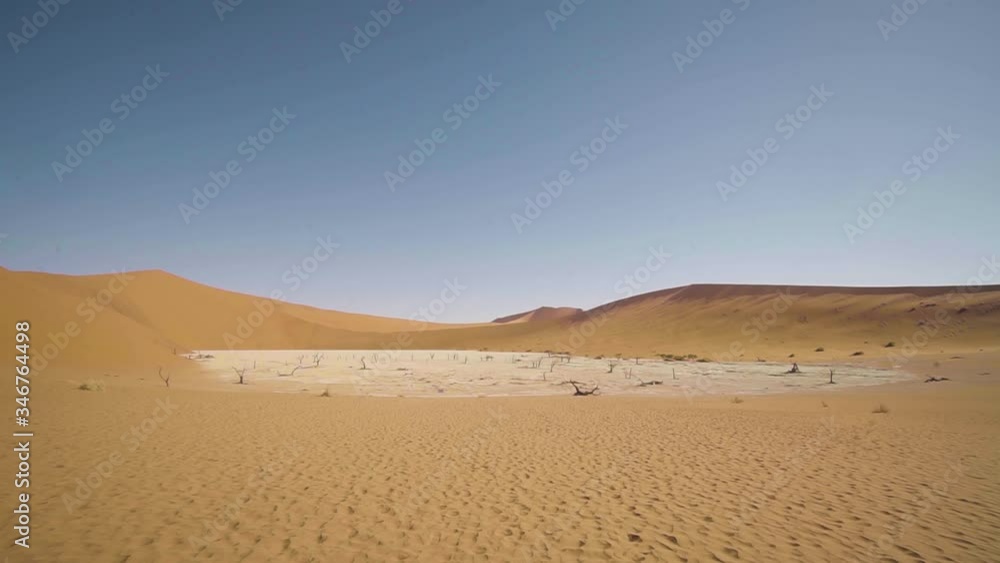 Full shot of the Dead Vlei in the Namib desert in Namibia, Africa. A dried up lake in the desert surrounded by sand dunes and dead trees. Full shot of the Dead Vlei in the Namib desert in Namibia, Africa. A dried up lake in the desert surrounded by sand dunes and dead trees.
