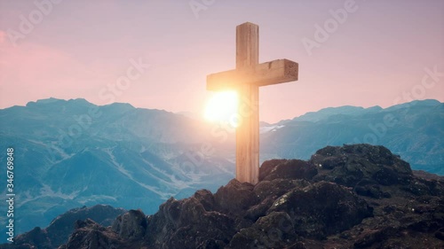 Cross on the mountain of Christian faith with sunrise of faith of Chris  photo