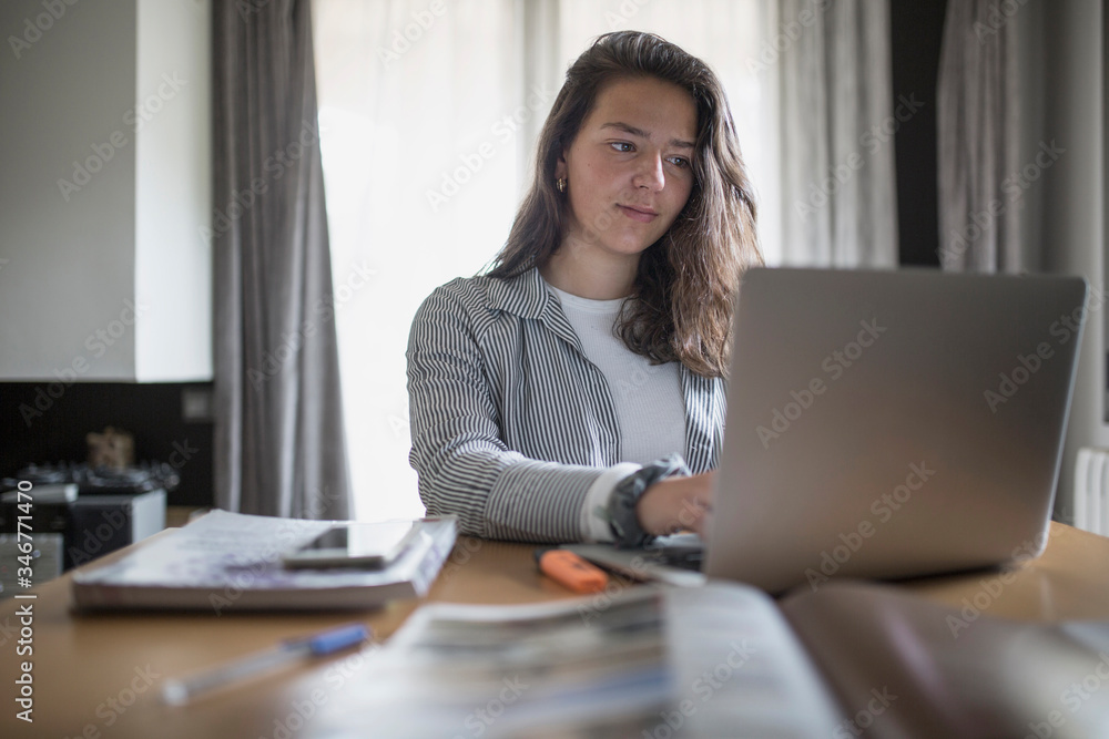 Girl studying and working at home Girl studying and working at home
