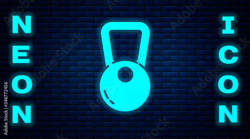 Glowing neon Kettlebell icon isolated on brick wall background. Sport equipment. Vector Illustration