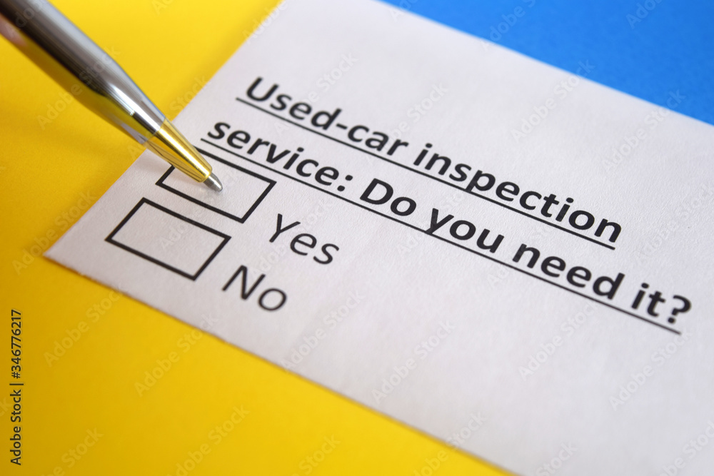 Obraz premium One person is answering question about used car inspection service.