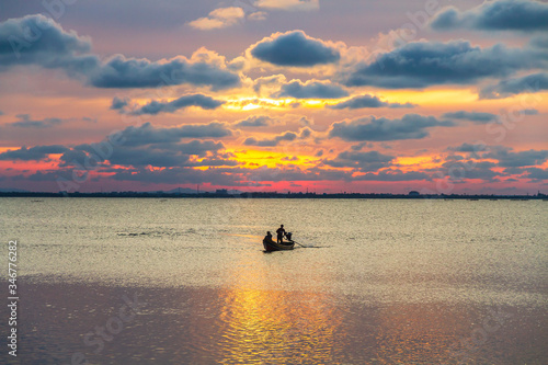Silhouette of a local fishing boat at the sea in Yaring District, Pattani, Thailand