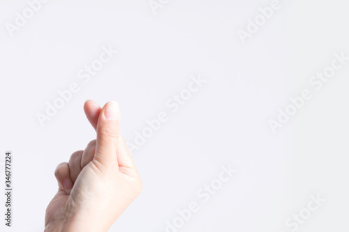 Close-up image of a symbol from a fingertip to be Love signs in Korean style called mini heart or little heart.