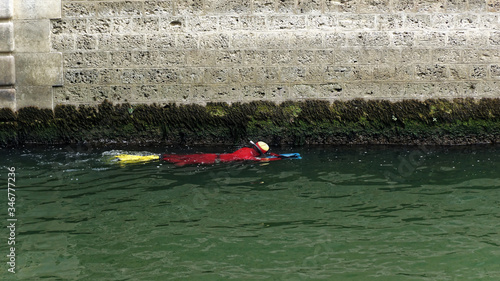 Checking the condition below the surface.  Siene Paris Europe. photo