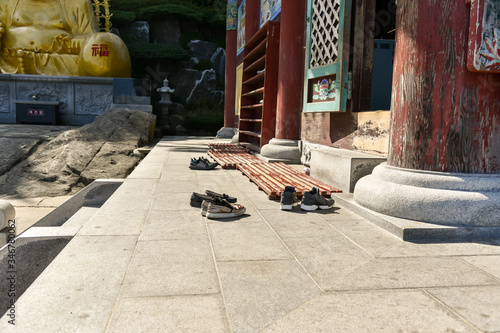 Take off your shoes before entering the temple