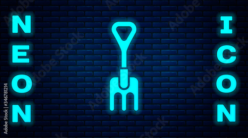 Glowing neon Garden rake icon isolated on brick wall background. Tool for horticulture, agriculture, farming. Ground cultivator. Vector Illustration