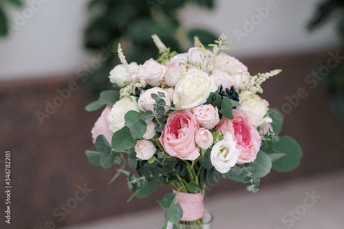 Wedding flowers, bridal bouquet closeup. Decoration made of roses, peonies and decorative plants, selective focus, nobody, objects