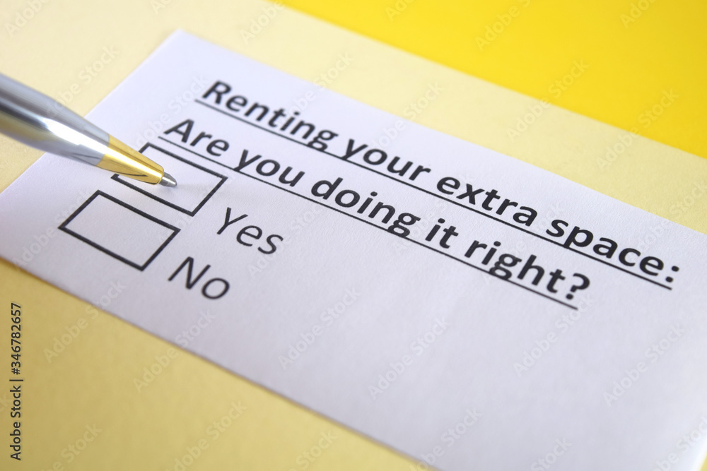 One person is answering question about renting extra space. One person is answering question about renting extra space.