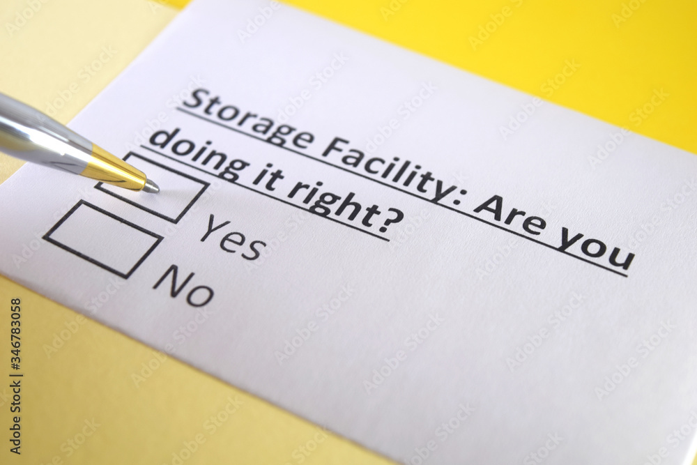 One person is answering question about storage facility. One person is answering question about storage facility.