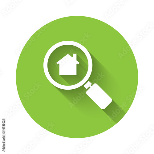 White Search house icon isolated with long shadow. Real estate symbol of a house under magnifying glass. Green circle button. Vector Illustration