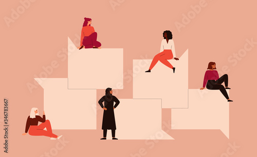 Strong girls different nationalities and cultures sit near the big speech bubbles. Women's friendship, union of feminists or sisterhood. The concept of the female's empowerment movement. 