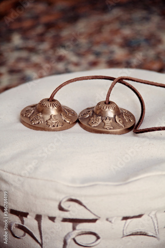 Cymbal Zimbeln on meditations cushion photo