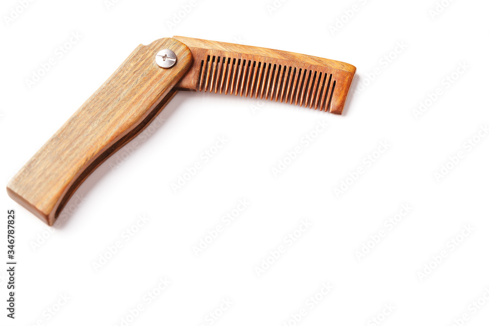 Sandalwood comb on a white background. Hair care. Sandalwood comb on a white background. Hair care.