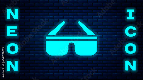 Glowing neon 3D cinema glasses icon isolated on brick wall background. Vector Illustration