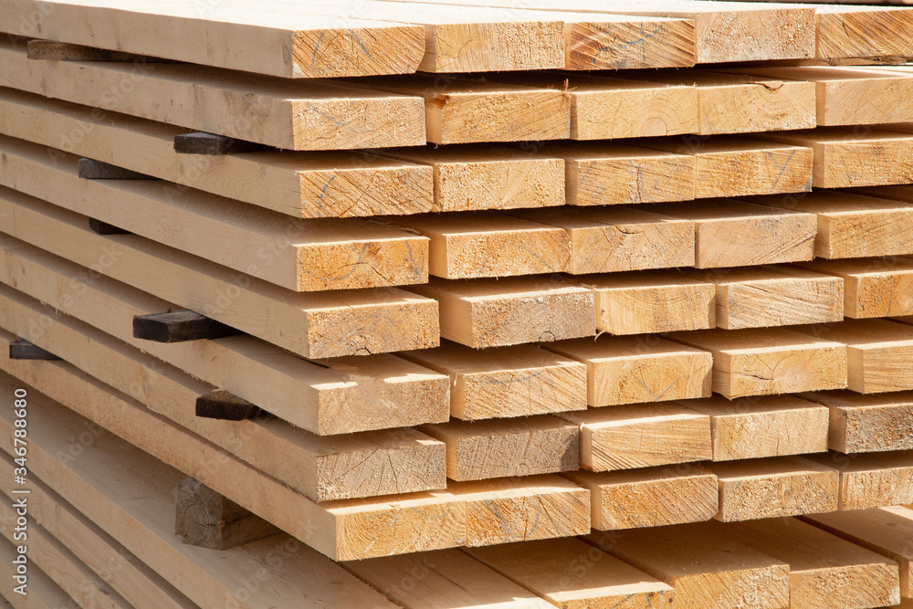 Edged boards in stock, ready for sale. Warehouse of construction materials. Edged boards in stock, ready for sale. Warehouse of construction materials.