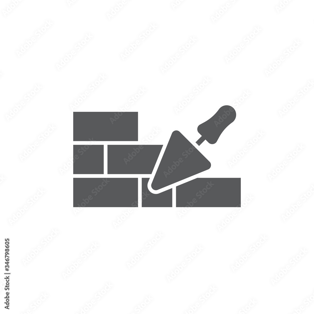 Trowel and brick wall vector icon symbol isolated on white background Trowel and brick wall vector icon symbol isolated on white background