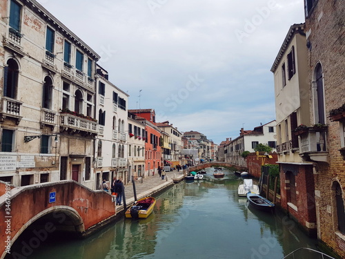 Venetian canal after the rain, ancient architecture of Italy
