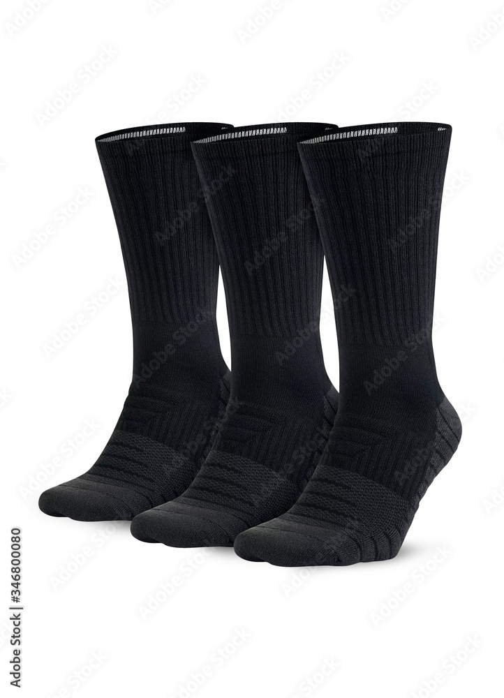 Three black socks isolated on white background. Three pair of socks. Set of short socks for sports on invisible foot as mock up for advertising, branding, design. Three black socks isolated on white background. Three pair of socks. Set of short socks for sports on invisible foot as mock up for advertising, branding, design.