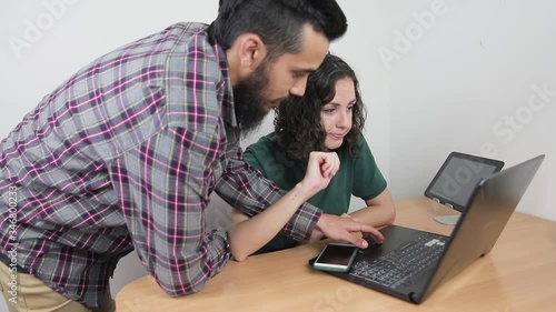 Young couple in the home office. Remote work